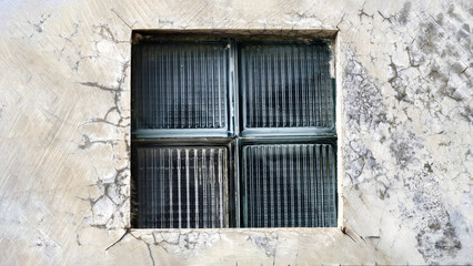 Abstract Concrete Wall Featuring Glass Brick Window for Creative Backgrounds