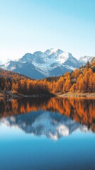 Obraz premium Serene autumnal lake nestled amidst majestic mountains. Tranquil alpine scenery with vibrant fall foliage reflected in still waters