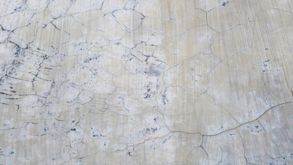 Abstract weathered wall texture with cracks and worn surface for background use