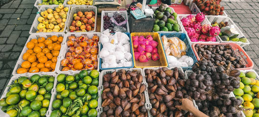 Abundance of fresh produce in baskets at a vibrant outdoor market display