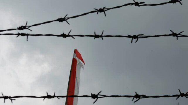 Indonesian flag, red and white with sky background