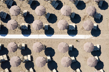 Aerial photo documentation of the beach in Versilia umbrellas aligned at the beginning of summer,
