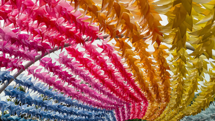 Colorful pinwheels create a vibrant display, adding a festive touch to an outdoor space
