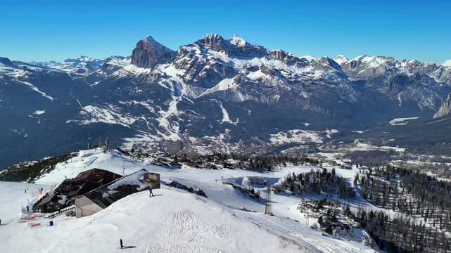 Cortina d'Ampezzo, Italy: Aerial view of famous ski resort in Dolomites (Dolomitic Alps)  and venue of Winter Olympics Milano Cortina 2026, sunny day - landscape panorama of Europe from above

