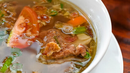 A Bowl of Delicious Nutritious Beef Rib Soup with Vegetables Close Up
