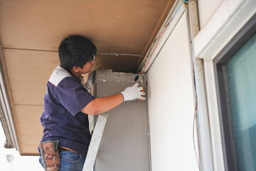 Man fix air conditioning systems, Technician service for repair and maintenance of air conditioners