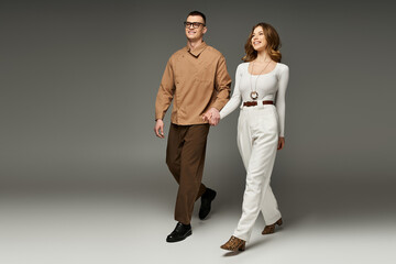 Joyful couple walking together in love with elegance and style during their special day