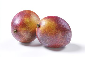 Fototapeta premium Two ripe mangoes, vibrant red and gold hues, sit on a white background.