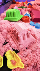 Kinetic sand playtime with colorful molds for endless creative possibilities