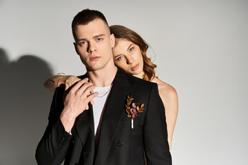 Elegant couple radiates love and romance in intimate moment captured during joyful celebration