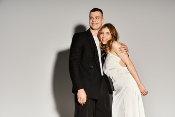 Joyful couple celebrates love together in elegant attire during a romantic moment