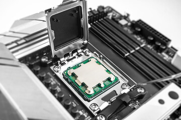 A central processing unit is securely seated in a motherboard socket, ready for the retention...