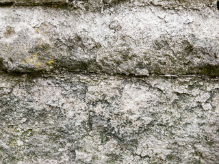 Weathered stone wall texture with cracked cement details