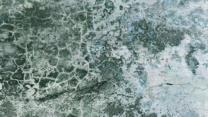 Weathered plaster surface with cracks and natural erosion patterns