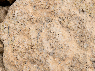 Weathered stone wall texture with cracked cement details