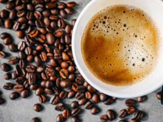 Coffee crema espresso in paper Coffee cup and bean, close-up, Top view of Espresso in  Takeaway paper coffee cup