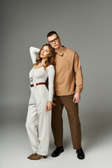 Elegant couple radiates romance in stylish attire during a memorable moment