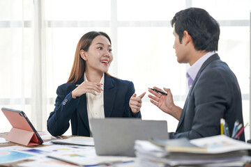 Business Colleagues Discussing Project in Office