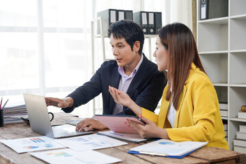 Business Professionals Collaborating on Laptop