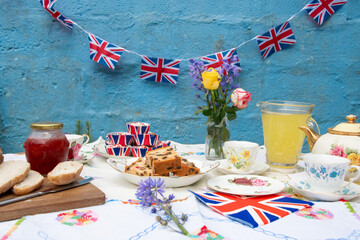 garden  party  afternoon  tea party  fruit  cakes and  china  with  bunting  vintage  style