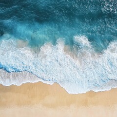 Ocean waves crash on golden sand