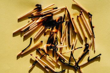 Conceptual image series using matches — new, burned, and burning — to represent stages of burnout, emotional fatigue, and mental exhaustion