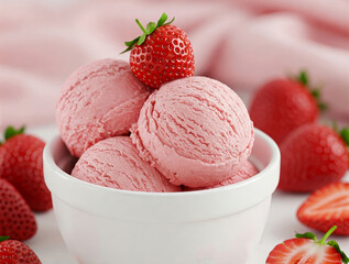 Close-up of a white bowl filled with three scoops of strawberries creamy ice cream, garnished with a fresh strawberry fruit slices