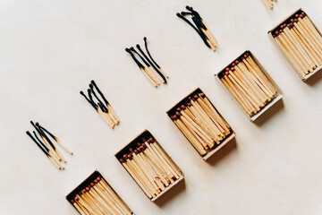 Conceptual image series using matches — new, burned, and burning — to represent stages of burnout, emotional fatigue, and mental exhaustion