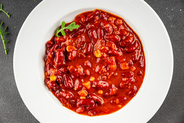 Chile con carne plate beans, tomato, corn, meat fresh delicious gourmet food background on the table rustic food top view copy space