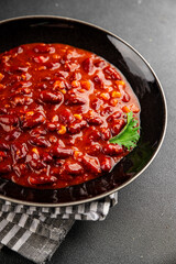 Chile con carne plate beans, tomato, corn, meat fresh delicious gourmet food background on the table rustic food top view copy space