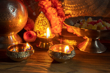 Diwali lamp diya or Deepavali or Deepawali. Hindu festival of lights. Celebrating in Indian religions Jainism and Sikhism. Offering to the gods, a spiritual rite. Close up view, out of focus