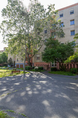 Residential panel building with visible sidewalk detail.