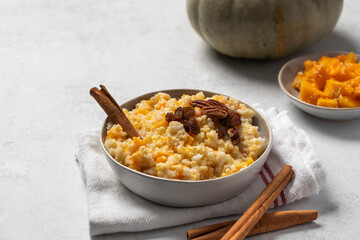 Rice millet porridge with pumpkin and cinnamon. Healthy breakfast