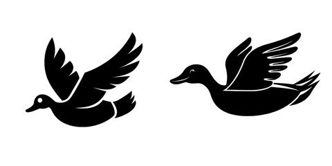 Fototapeta premium A modern bird with the physical attributes of a goose is captured in mid-air, its silhouette that of a wild duck flying solo