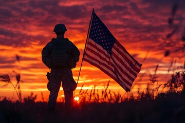 American Soldier in Uniform Standing by U.S. Flag at Sunset for Memorial Day Tribute