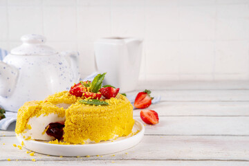 No-bake Upside Down Cheesecake, viral trendy version of classic Cheesecake New York with golden cookie crumbles, white cream cheese and berry jam layers, with fresh strawberry and mint on wooden table