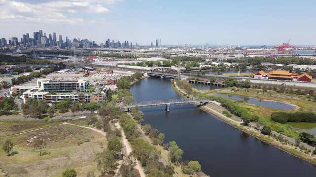 Aerial drone over Kensington suburb, moving towards Melbourne city skyline
