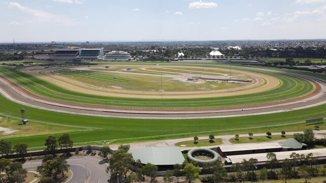 Aerial drone moves back from Flemington Racecourse, Melbourne, on a summer&rsquo;s day