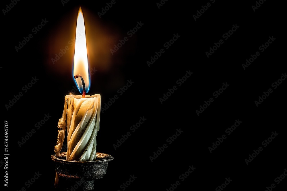 Poster flickering candlelight shines brightly in dark surroundings, casting warm shadows and creating a tra