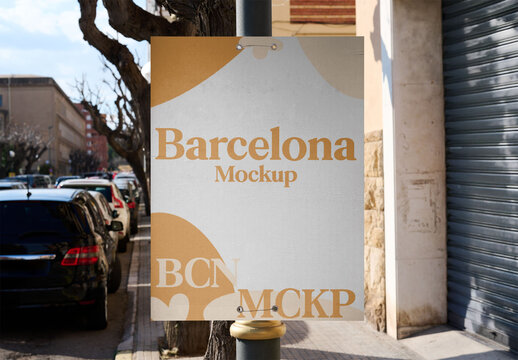 Mockup poster displayed on an urban lamppost in daylight.