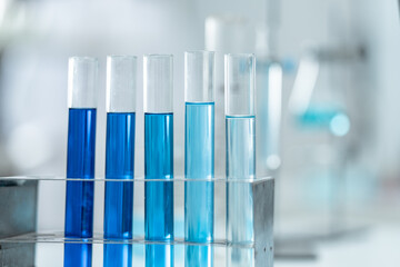 Chemical laboratory glassware with blue liquid samples in test tubes, scientific research experiment, biotechnology innovation, pharmaceutical analysis development, medical diagnostics