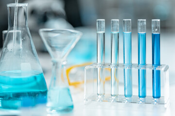 Chemical laboratory glassware with blue liquid samples in test tubes, scientific research experiment, biotechnology innovation, pharmaceutical analysis development, medical diagnostics