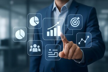 A businessman uses a futuristic interface to monitor business growth, sales, and targets. The image conveys efficiency and success.