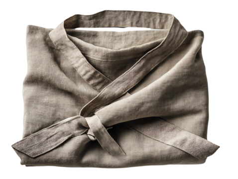 Folded linen apron with tie, white isolate background