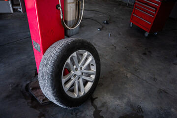 Fototapeta premium Mechanic shop interior with car tire and repair equipment displayed