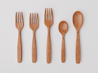 Five bamboo utensils, including forks and spoons, are neatly arranged side by side on a light background.