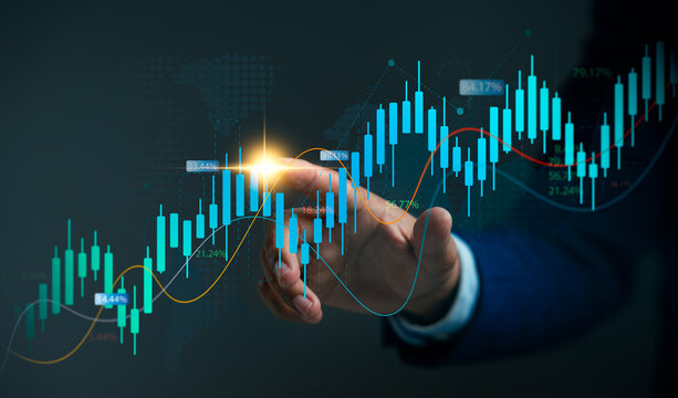 Businessman analyzing market trends and financial graph on virtual technology. Represent real time trading data,Fintech,Investment planning,Economic performance forecasting for strategic growth.