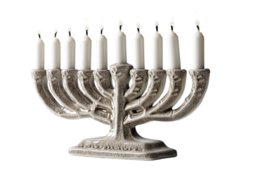 Menorah with lit candles on a white isolated background