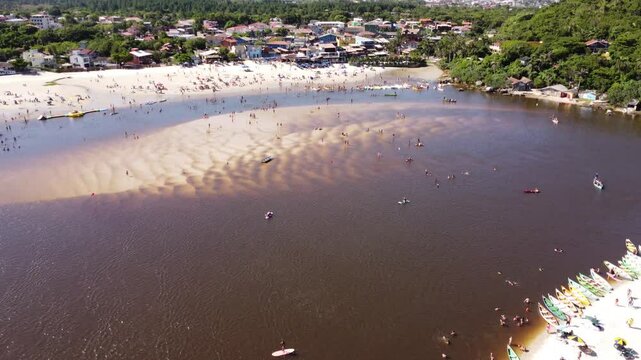 4K Aerial Tilt Down Over Guarda do Emba&uacute; Beach and River with Coastal Life &ndash; Brazil