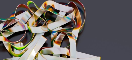 Close-up of colorful, metallic ribbons arranged in an abstract composition.
